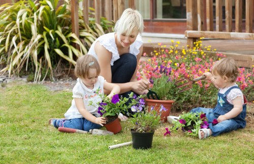 Seasonal garden maintenance with plants, borders, and lawn care in North Kensington