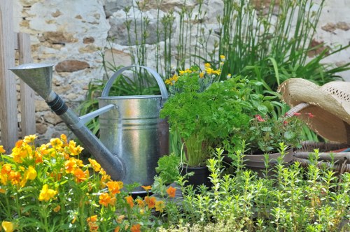 Urban garden care in North Kensington with flowers, shrubs, and clean pathways